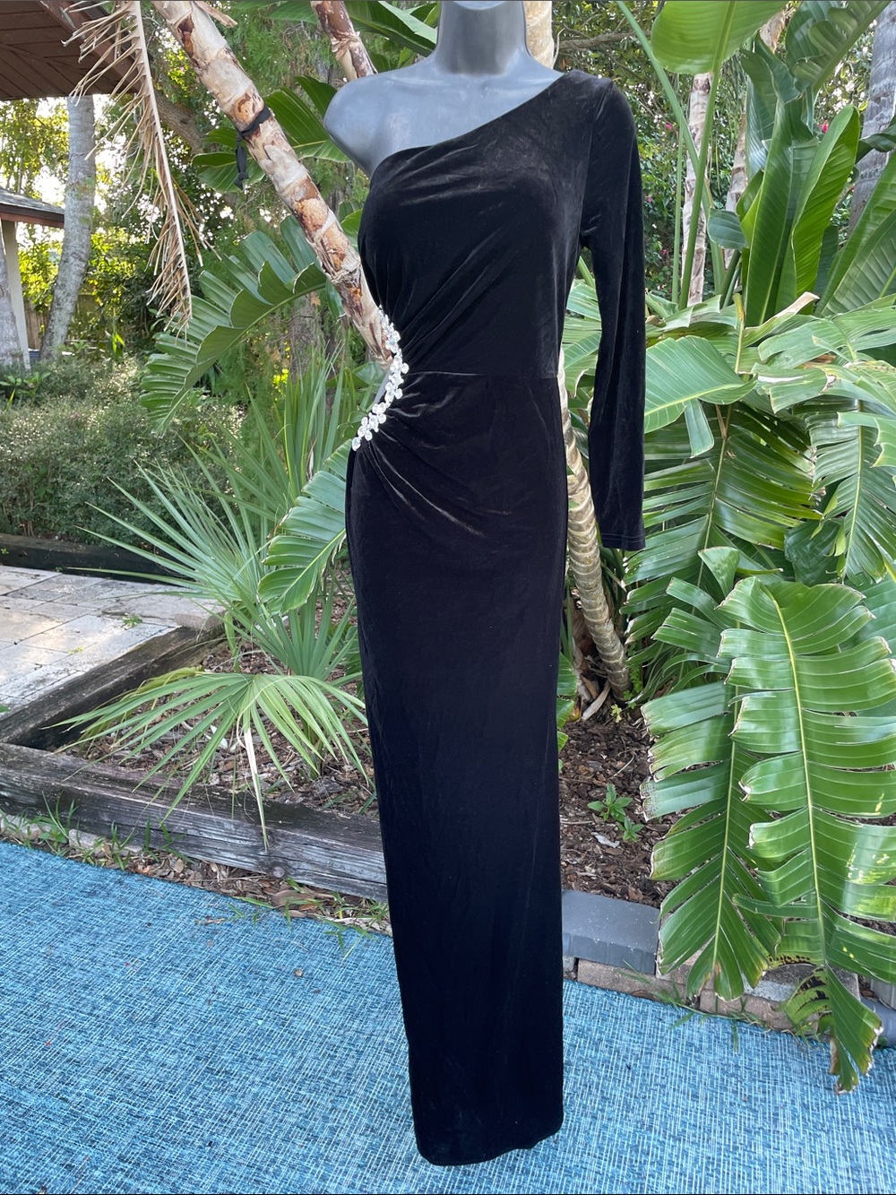Black velvet, one shoulder, cut out gown with large rhinestone beating